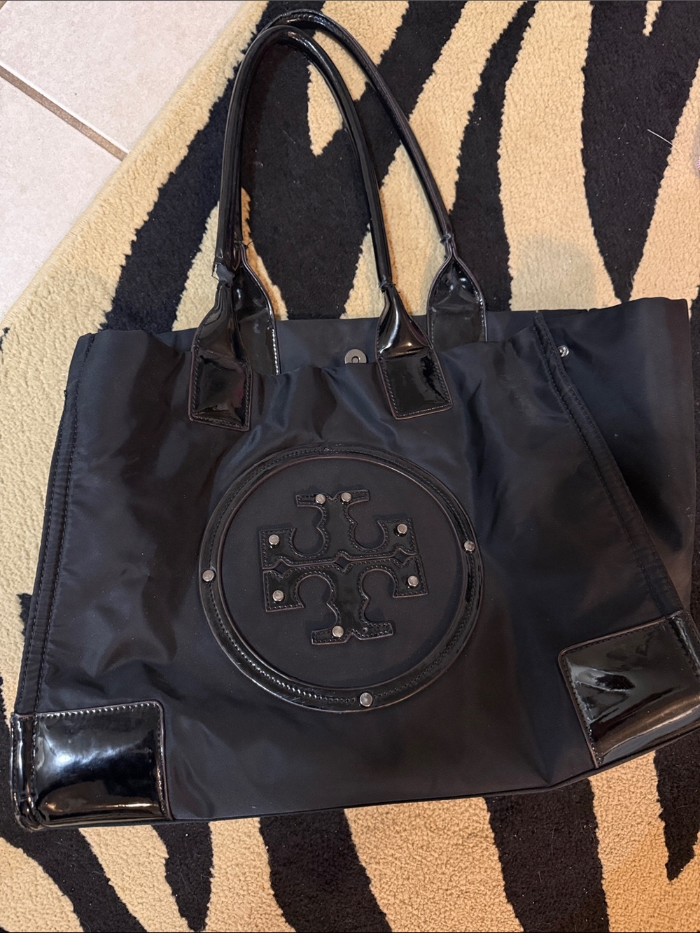 Tory Burch Black Nylon Tote with Patent Leather Trim & studs on logo.